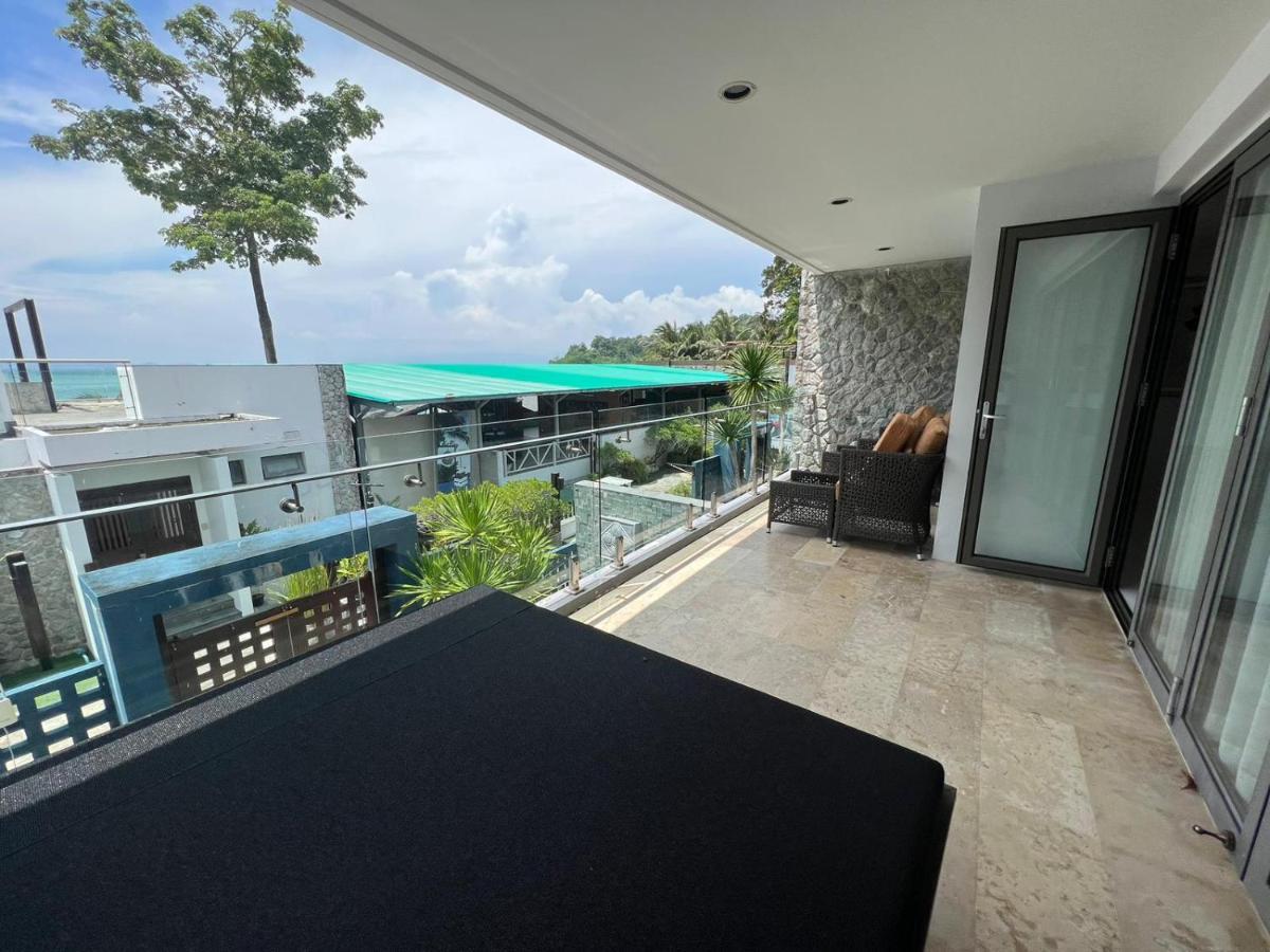 The Nchantra Beachfront Resort Phuket Exterior photo