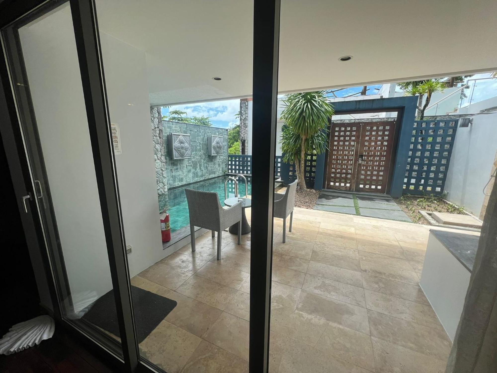 The Nchantra Beachfront Resort Phuket Exterior photo