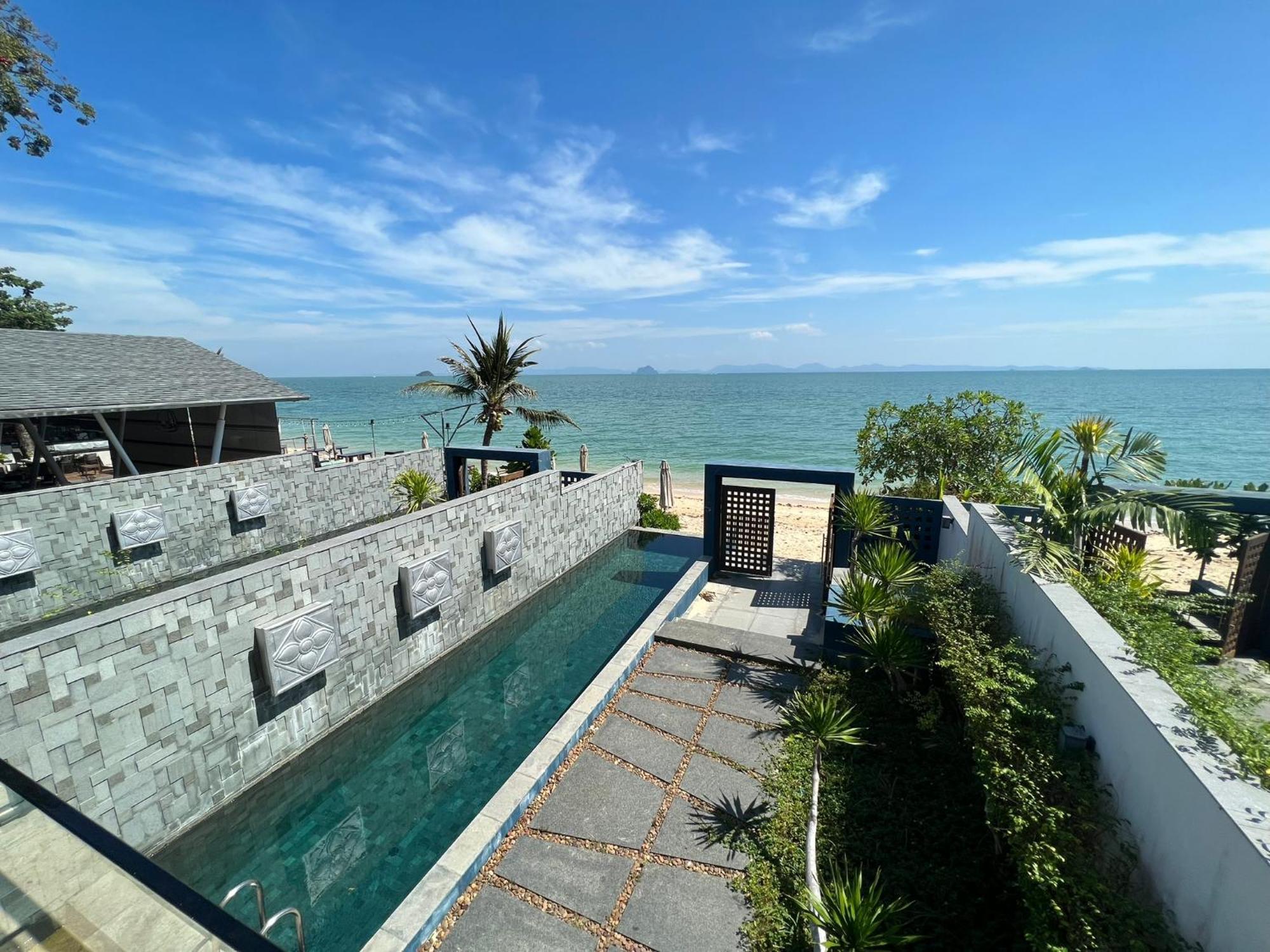 The Nchantra Beachfront Resort Phuket Exterior photo