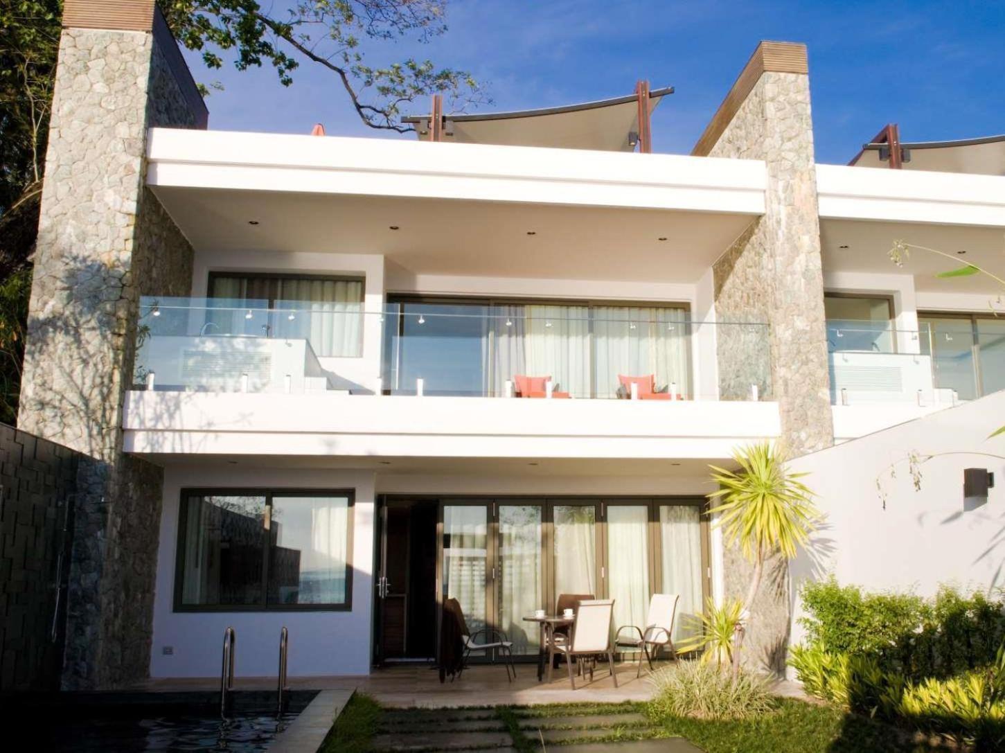 The Nchantra Beachfront Resort Phuket Exterior photo