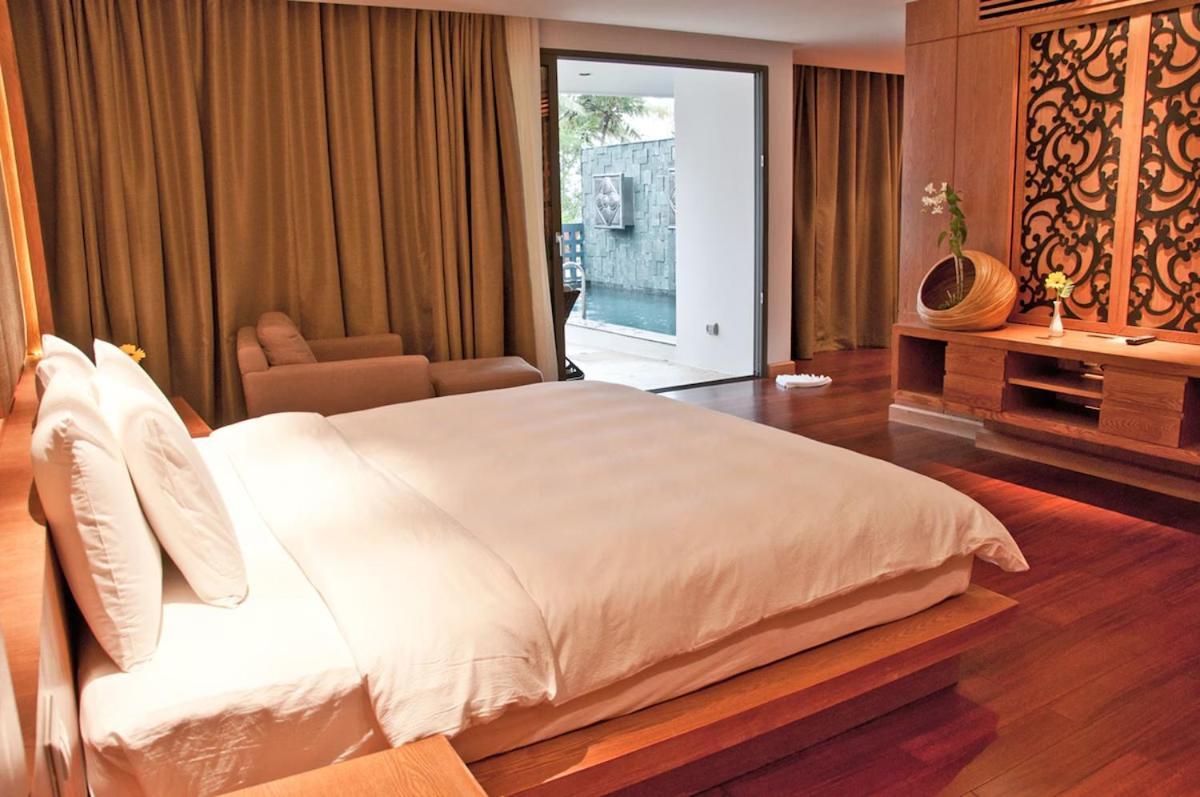The Nchantra Beachfront Resort Phuket Exterior photo