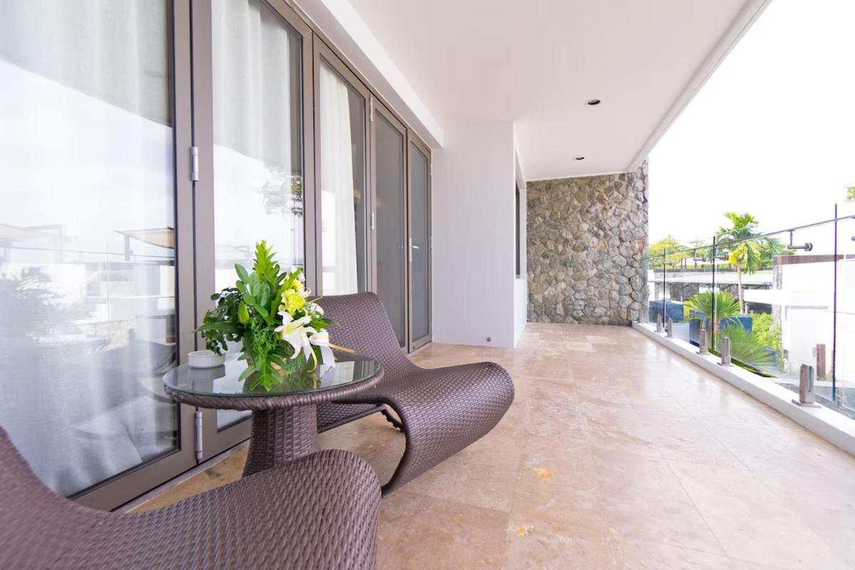The Nchantra Beachfront Resort Phuket Exterior photo