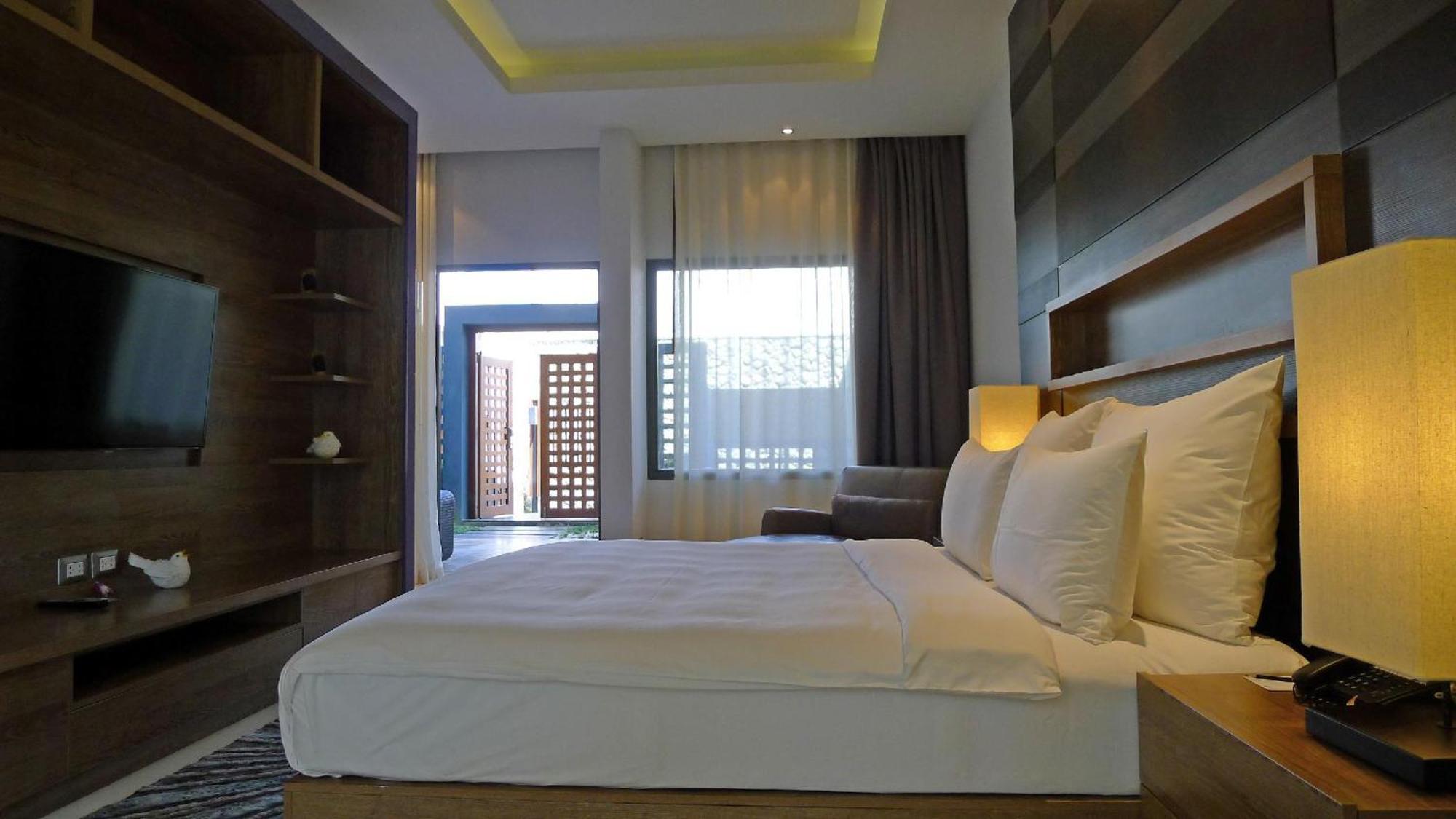 The Nchantra Beachfront Resort Phuket Exterior photo